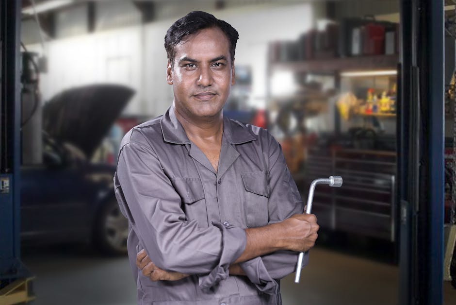 Smiling auto repair technician ready to assist